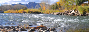 Flowing water with the Boulder Flatirons in the background.