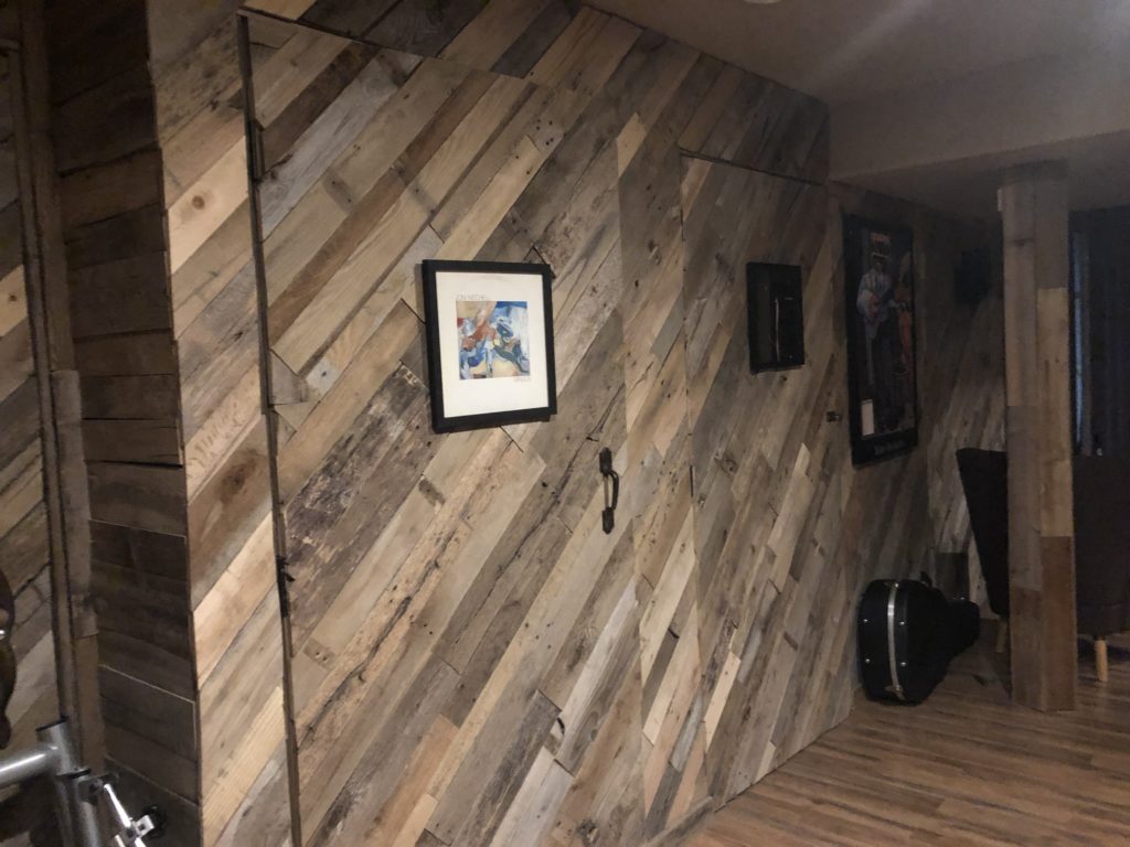 Wall made from reclaimed lumber pallets by Janeen Davis.