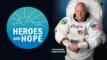 A blue Conservation Heroes & Hope logo next to a photograph of Captain Scott Kelly in his astronaut uniform.