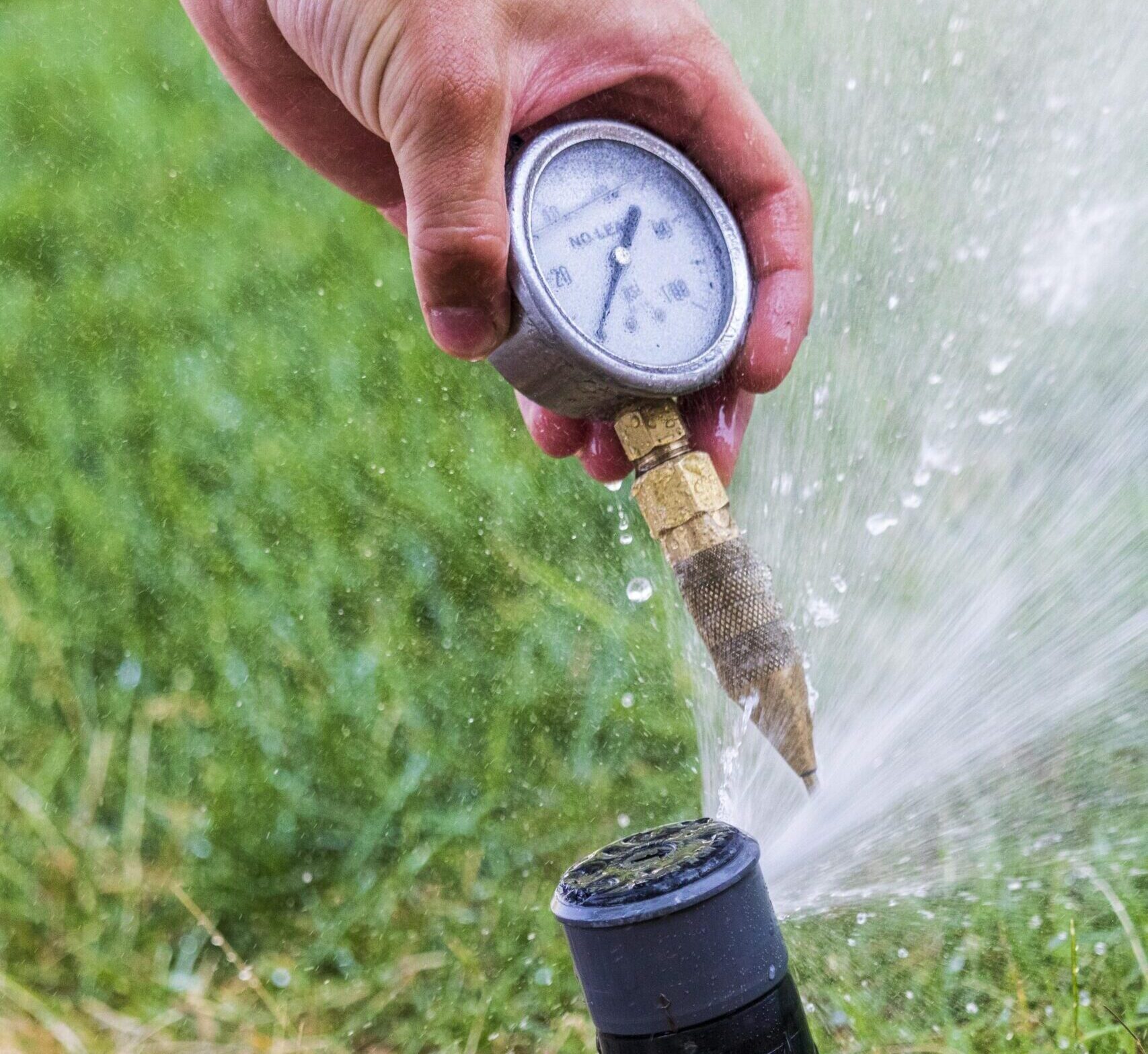 Water pressure gauge cropped Pressure gauge on an sprinkler system in Colorado yard