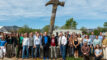 Earth Day 2026 Event with Governor Jared Polis, Mayor Aaron Brockett, Resource Central President & CEO Neal Luri, Eco-Cycle Executive Director Suzanne Jones, and community leaders, and staff standing next to a 15-foot hammer sculpture