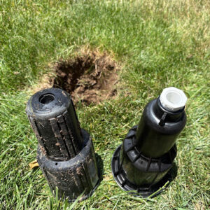 the sprinklers next to a whole with an adapter added to one of them. 